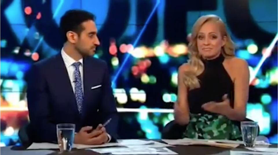 Carrie and Waleed Aly behind the desk on The Project discussing their distress at seeing images of a Syrian toddler's body being carried ashore. 