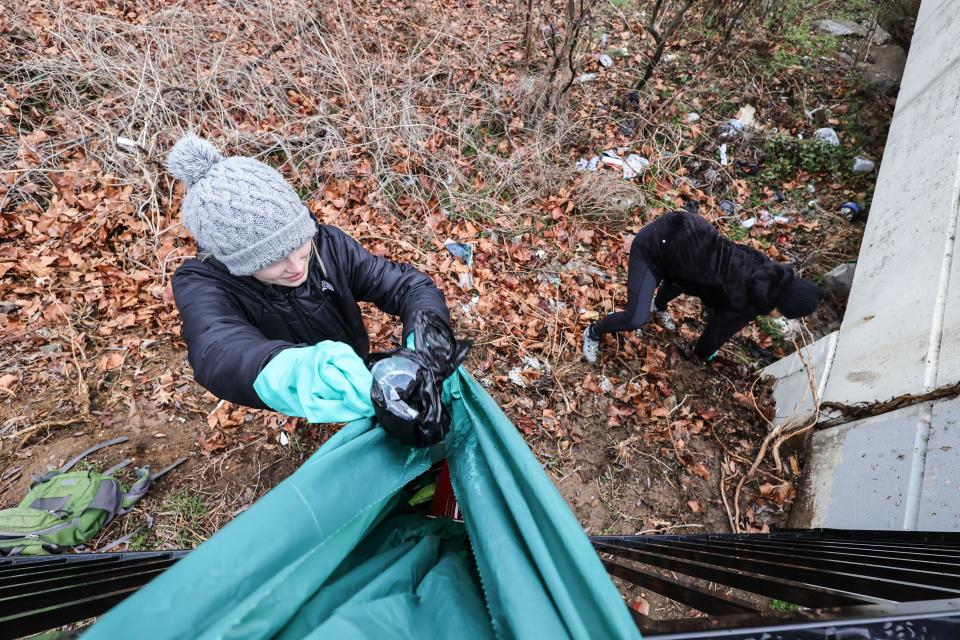 Volunteers take part in the West Side Grows Together 10th annual Dr. Martin Luther King community cleanup in Wilmington on Monday, Jan. 17, 2022, which was Martin Luther King Jr. Day. They started at West Seventh and North Jackson streets.