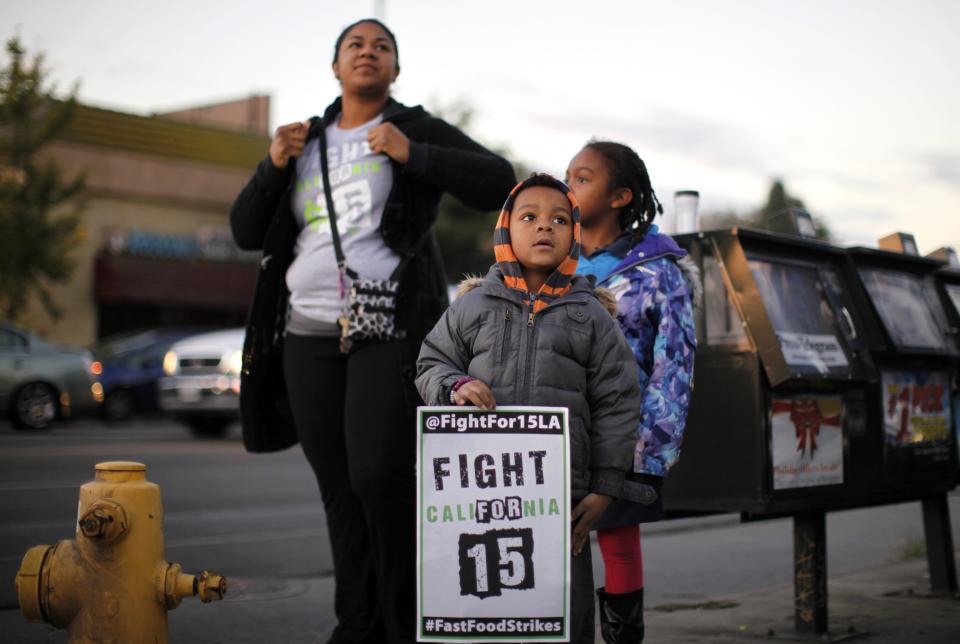 Protesters gather outside McDonald's in Los Angeles, California, December 5, 2013. Organizers say fast food workers will strike in 100 U.S. cities, and there will be protests in 100 more, to fight for $15 an hour wages and the right to form a union. (REUTERS/Lucy Nicholson)