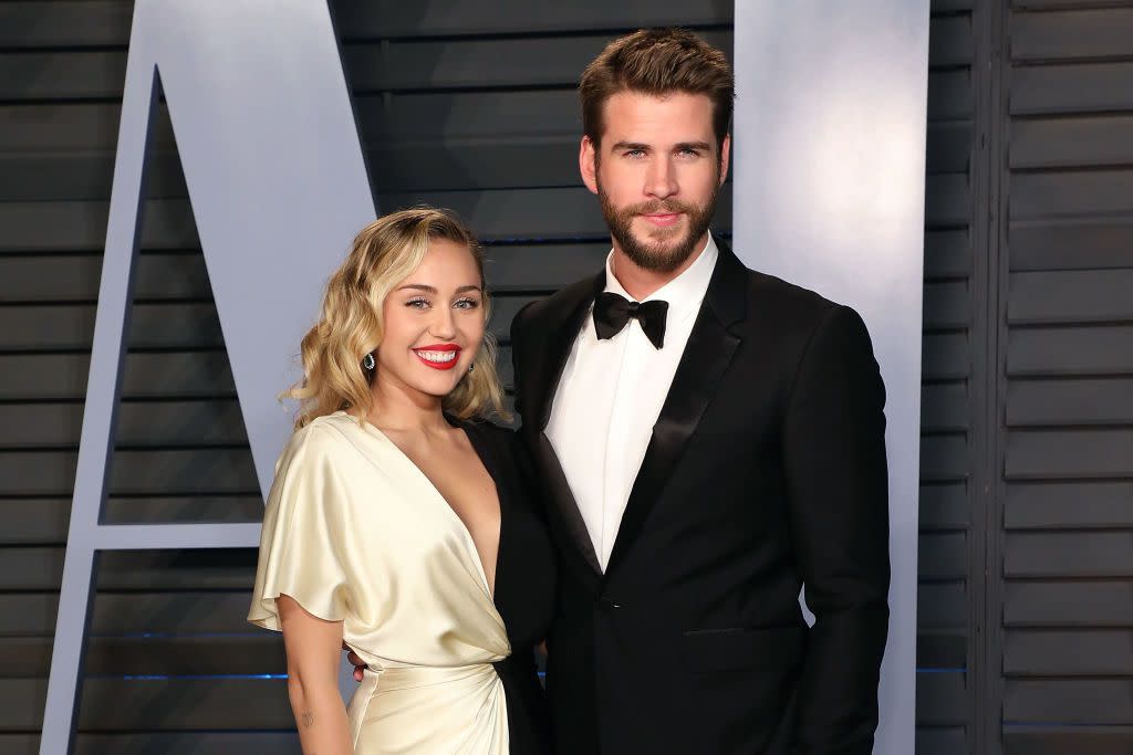 Miley Cyrus and Liam Hemsworth attend the 2018 Vanity Fair Oscar Party hosted by Radhika Jones at the Wallis Annenberg Center for the Performing Arts on March 4, 2018 in Beverly Hills, California.