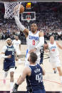 Los Angeles Clippers guard Russell Westbrook (0) shoots as Dallas Mavericks forward Maxi Kleber (42) defends during the second half in Game 5 of an NBA basketball first-round playoff series Wednesday, May 1, 2024, in Los Angeles. (AP Photo/Mark J. Terrill)