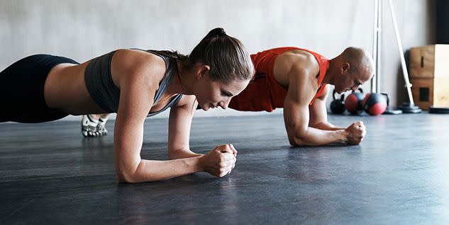 two fit girls training with personal trainer in gym, attractive african and  caucasian women with strong male have rest after exercises Stock Photo -  Alamy