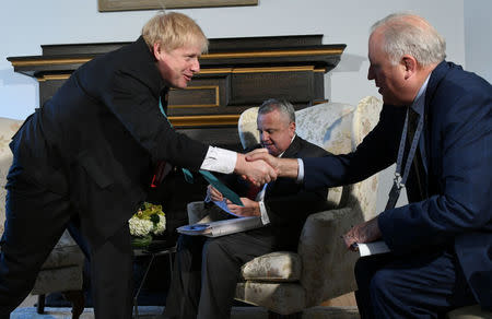 Britain's Foreign Secretary Boris Johnson and U.S. Under Secretary of State Tom Shannon shake hands in the office of the chancellor at the University of Toronto to begin an informal bilateral meeting during G7 foreign ministers meetings, in Toronto, Ontario, Canada April 22, 2018. Dave Clark/Pool via REUTERS