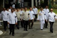 President Benigno S. Aquino III, his Cabinet official and security wore black armbands during the arrival honors for the late Interior and Local Government Secretary Jesse Robredo at the Kalayaan Grounds, Malacanan Palace on Friday (August 24). His remains will lie in state in Kalayaan Hall, Malacanang until Sunday morning (August 26). President Aquino signed Proclamation No. 460, declaring National Days of Mourning starting August 21 to mark the death of the former DILG Chief until his interment. The national flag will be flown at half-mast from sunrise to sunset in all government buildings in the Philippines and in the country’s posts abroad for a period of six days. (Photo by: Jay Morales / Malacañang Photo Bureau).