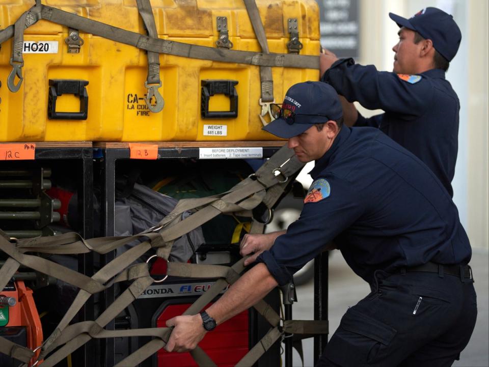 Los Angeles firefighters prepare to deploy to Turkey on 6 February 2023 (Allison Dinner/EPA)