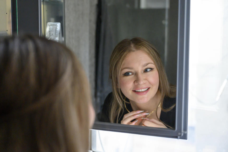 Anna Delvey touches up her makeup while on house arrest in her East Village apartment on November 7, 2022 in New York City.