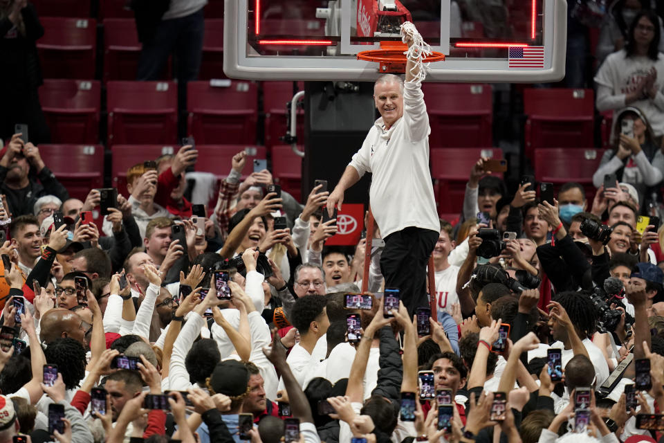 San Diego State head coach Brian Dutcher holds the net after San Diego State defeated Wyoming in an NCAA college basketball game to win the Mountain West Conference Saturday, March 4, 2023, in San Diego. (AP Photo/Gregory Bull)