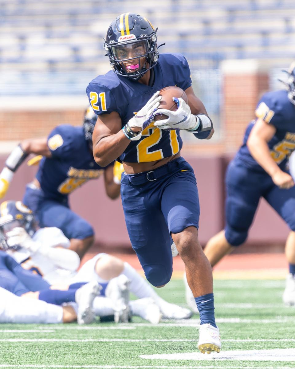 Haslett's Nakai Amachree takes the opening kickoff back for a touchdown in the Battle of the Big House matchup with Dewitt Thursday, Aug. 25, 2022 in Ann Arbor.