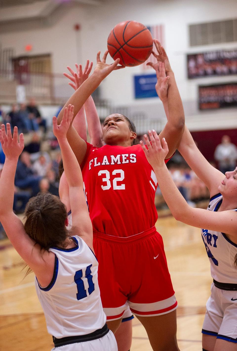 Mansfield Christian's Kyleah Jones is fouled attempting a shot.