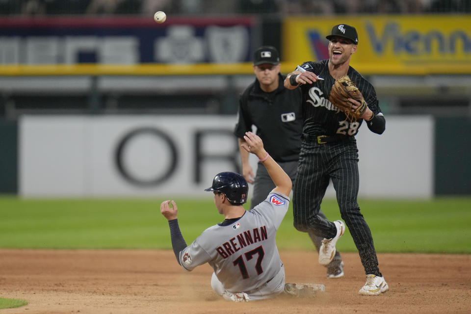 Cleveland Guardians' Will Brennan (17) is out at second and Chicago White Sox second baseman Zach Remillard throws to first for a double play during the seventh inning of a baseball game Friday, July 28, 2023, in Chicago. (AP Photo/Erin Hooley)