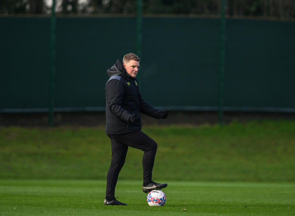 NEWCASTLE UPON TYNE, ENGLAND - JANUARY 04: Newcastle United Head Coach Eddie Howe  gestures instructions whilst standing on a ball during the Newcastle United Training Session at the Newcastle United Training Centre on January 04, 2024 in Newcastle upon Tyne, England. (Photo by Serena Taylor/Newcastle United via Getty Images)