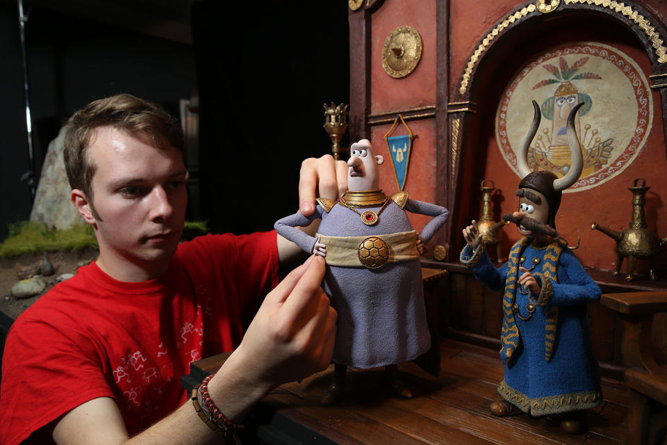 An Aardman animator adjusts a model of Lord Nooth used in the film. (Studiocanal)