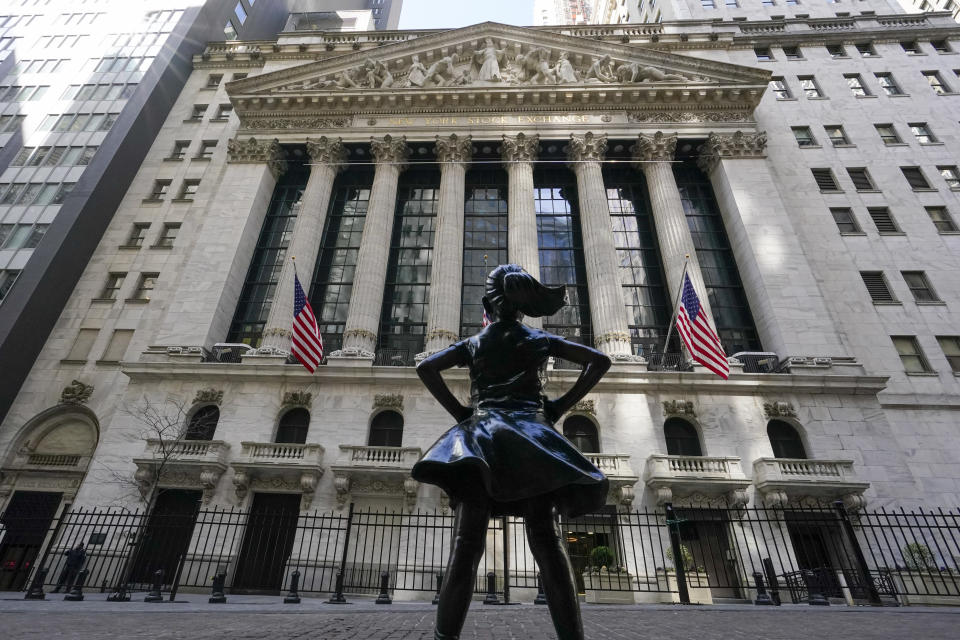 FILE - In this March 23, 2021 file photo, the Fearless Girl statue stands in front of the New York Stock Exchange in New York's Financial District. Stocks are opening broadly higher on Wall Street, getting June off to a strong start as traders returned from the Memorial Day holiday in the U.S. (AP Photo/Mary Altaffer, File)