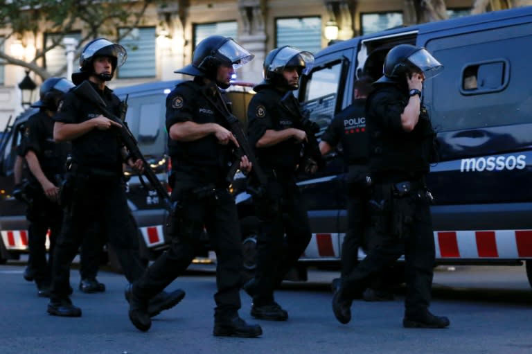 Spanish police cordon off Las Ramblas avenue in central Barcelona after a van ploughed into a crowd, killing 13 people on August 17, 2017