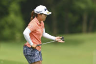 Nasa Hataoka of Japan holds her golf club before putting on the 18th green during the final round of the LPGA Honda Thailand golf tournament in Pattaya, southern Thailand, Sunday, May 9, 2021. (AP Photo/Kittinun Rodsupan)