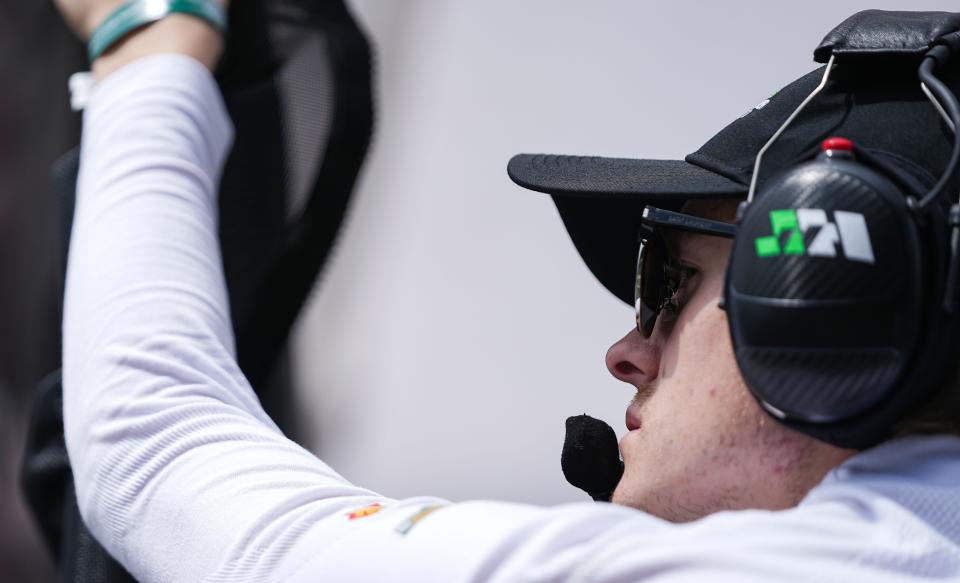 Juncos Hollinger Racing driver Callum Ilott (77) stands in pit lane during open test practice in preparation for the 107th running of the Indianapolis 500 on Thursday, April 20, 2023 at the Indianapolis Motor Speedway in Indianapolis. 