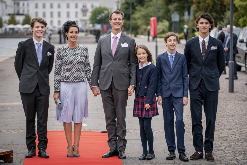 FILE - Prince Felix, Princess Marie, Prince Joachim, Princess Athena, Prince Henrik and Prince Nikolai at luncheon on the Royal Yacht Dannebrog to mark the 50th anniversary of Danish Queen Margrethe II's accession to the throne in Copenhagen, Denmark, Sunday, Sept. 11, 2022. Denmark’s popular monarch, Queen Margrethe II, has said that the “strong reactions” to her decision to strip the royal titles from four of her grandchildren have affected her, sparking reports in the Danish press of tense relations within Europe’s oldest ruling monarchy. (Mads Claus Rasmussen/Ritzau Scanpix via AP, File)