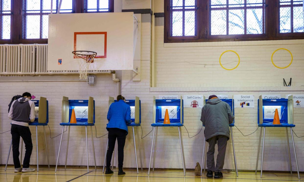 <span>Residents vote at a polling station in Minneapolis, Minnesota, on 3 November 2020.</span><span>Photograph: Kerem Yücel/AFP/Getty Images</span>