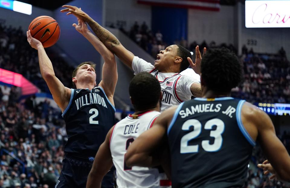 Villanova Wildcats guard Collin Gillespie (2) shoots against Connecticut Huskies guard Jordan Hawkins (24) in the second half at XL Center.