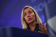 European Union Foreign Policy chief Federica Mogherini talks to journalists during a joint news conference with UN High Commissioner for Refugees Filipo Grandi and UN Migration Agency Director General Antonio Vitorino at the EU headquarters in Brussels, Tuesday, Oct. 29, 2019. The European Union says a "solidarity conference" has raised around 120 million euros ($133 million) for Venezuelans fleeing their crisis-wracked country and to help countries who are hosting them. (AP Photo/Francisco Seco)