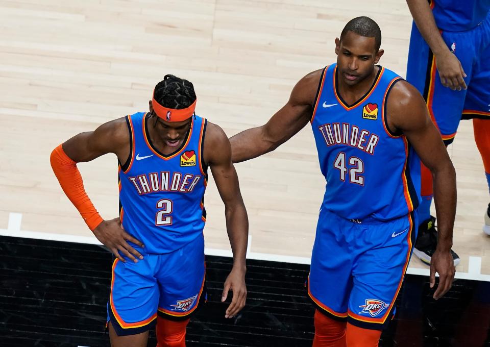 Then-Thunder forward Al Horford (42) consoles guard Shai Gilgeous-Alexander (2) after after a foul was called on Gilgeous-Alexander during the second half of a game against the Hawks on March 18, 2021, in Atlanta.