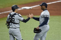 New York Yankees relief pitcher Aroldis Chapman shakes hands with catcher Kyle Higashioka (66) after closing out the Tampa Bay Rays during a baseball game Wednesday, May 12, 2021, in St. Petersburg, Fla. (AP Photo/Chris O'Meara)