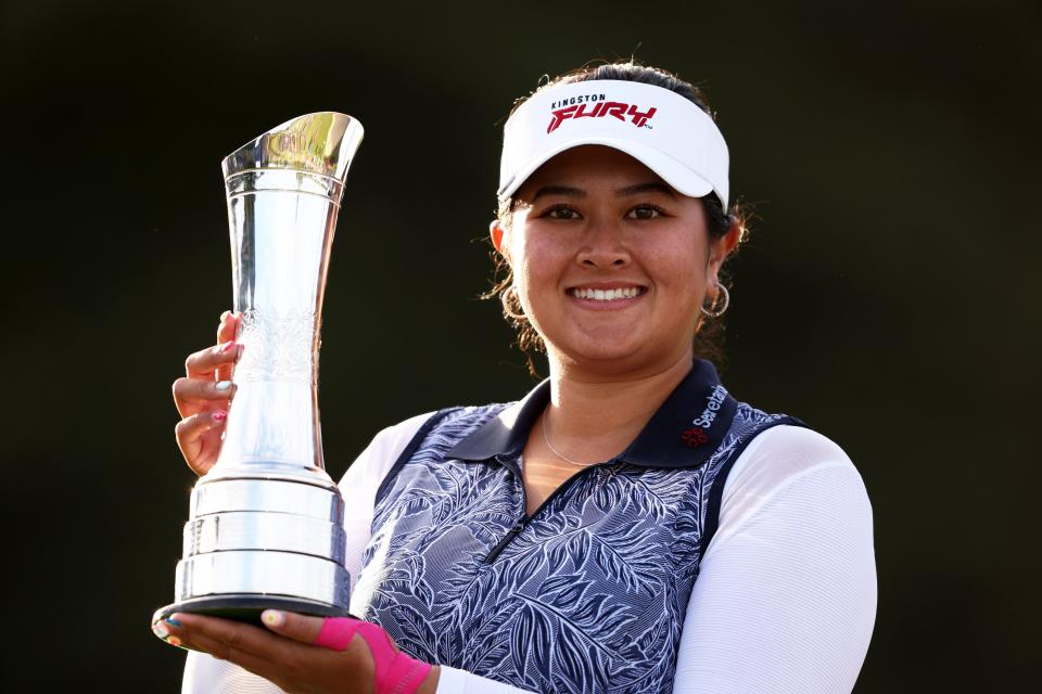 American Lilia Vu lifts the championship trophy after winning the AIG Women's Open Trophy at Walton Heath Golf Club in Tadworth, England.