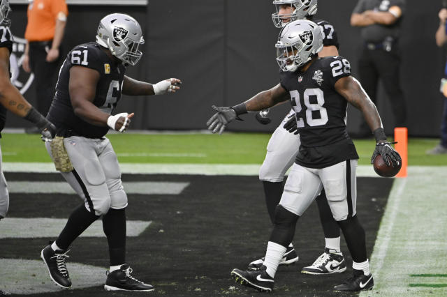 Oakland Raiders running back Josh Jacobs (28) celebrates after