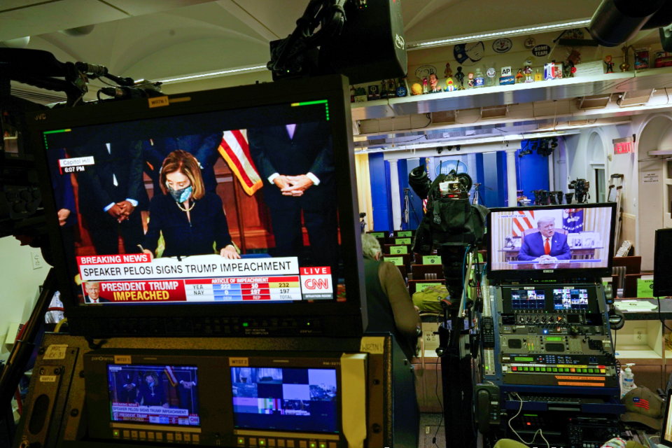 President Donald Trump is seen speaking on a television monitor in an empty press briefing room at the White House, from a video statement released by Trump on Twitter as it is broadcast by FOX News.
