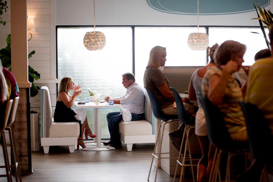 AquaGrille restaurant, which opened in March, transformed a Juno Beach space where a pretzels-and-beer franchise once operated.