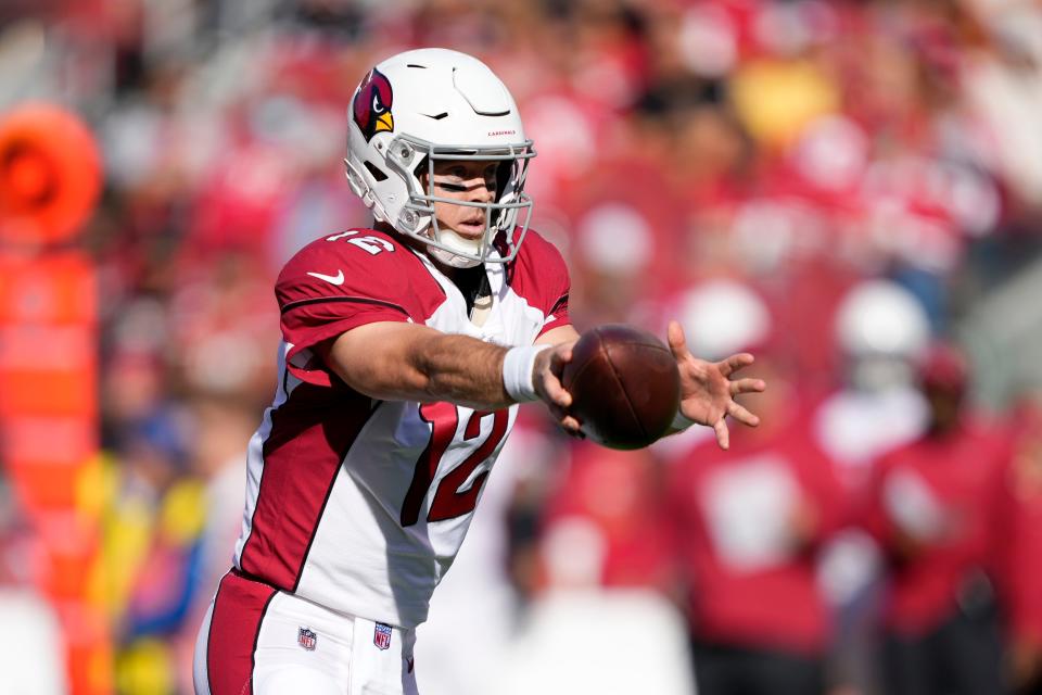 Arizona Cardinals quarterback Colt McCoy (12) hands off the ball against the San Francisco 49ers during the first half of an NFL football game in Santa Clara, Calif., Sunday, Nov. 7, 2021. (AP Photo/Tony Avelar)