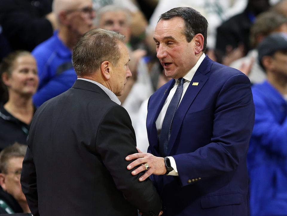 Dec 3, 2019; East Lansing, MI, USA; Michigan State Spartans head coach Tom Izzo and Duke Blue Devils head coach Mike Krzyzewski shake hands at mid court during the second half of a game at Breslin Center. Mandatory Credit: Mike Carter-USA TODAY Sports