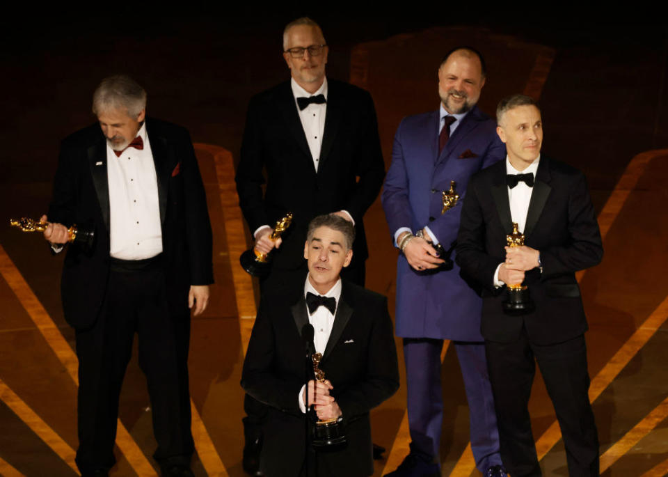 Mark Weingarten, Mark Taylor, Al Nelson, James Mather, and Chris Burdon accept the Best Sound award for "Top Gun: Maverick"