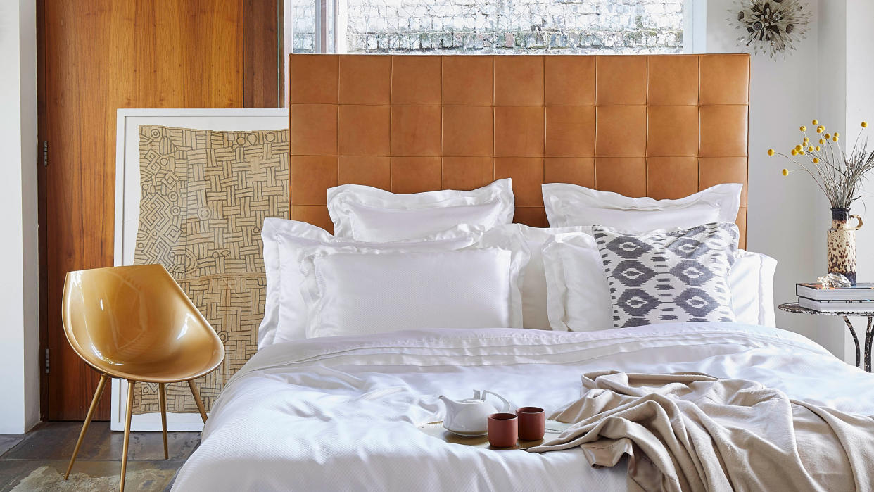  A modern bedroom with white silk sheets. 