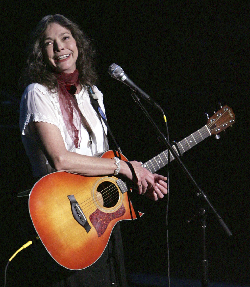 FILE - Nanci Griffith performs during the ACLU Freedom Concert Oct. 4, 2004, in New York. Griffith, the Grammy-winning folk singer-songwriter from Texas whose literary songs like “Love at the Five and Dime” celebrated the South, has died. She was 68. A statement from her management company on Friday, Aug. 13, 2021, confirmed her death, but no cause of death was provided. (AP Photo/Julie Jacobson, File)