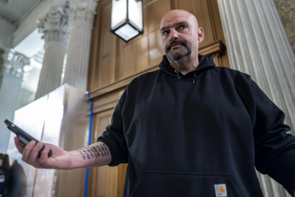 Sen. John Fetterman, D-Pa., arrives as the Senate holds a procedural vote on a package of wartime funding for Ukraine, Israel and other U.S. allies, at the Capitol in Washington, Friday, Feb. 9, 2024. (AP Photo/J. Scott Applewhite)