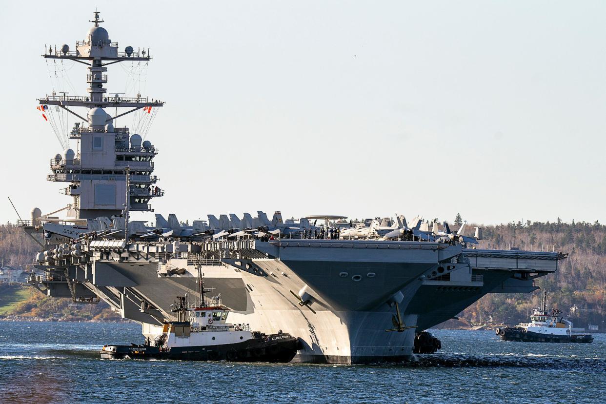 FILE - The USS Gerald R. Ford, one of the world's largest aircraft carriers, arrives in Halifax on Oct. 28, 2022. The Pentagon has ordered the Ford carrier strike group to sail to the Eastern Mediterranean to be ready to assist Israel, two U.S. officials said Sunday, Oct. 8, 2023. The USS Gerald R. Ford and its approximately 5,000 sailors and deck of warplanes will be accompanied by cruisers and destroyers in a show of force that is meant to be ready to respond to anything, from possibly interdicting additional weapons from reaching Hamas and conducting surveillance. (Andrew Vaughan/The Canadi