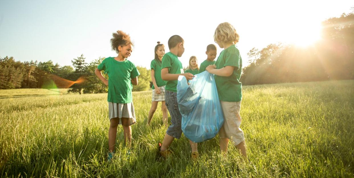 multiethnic group of children collecting trash as part of a volunteer project kids who feel they add value also feel like they matter