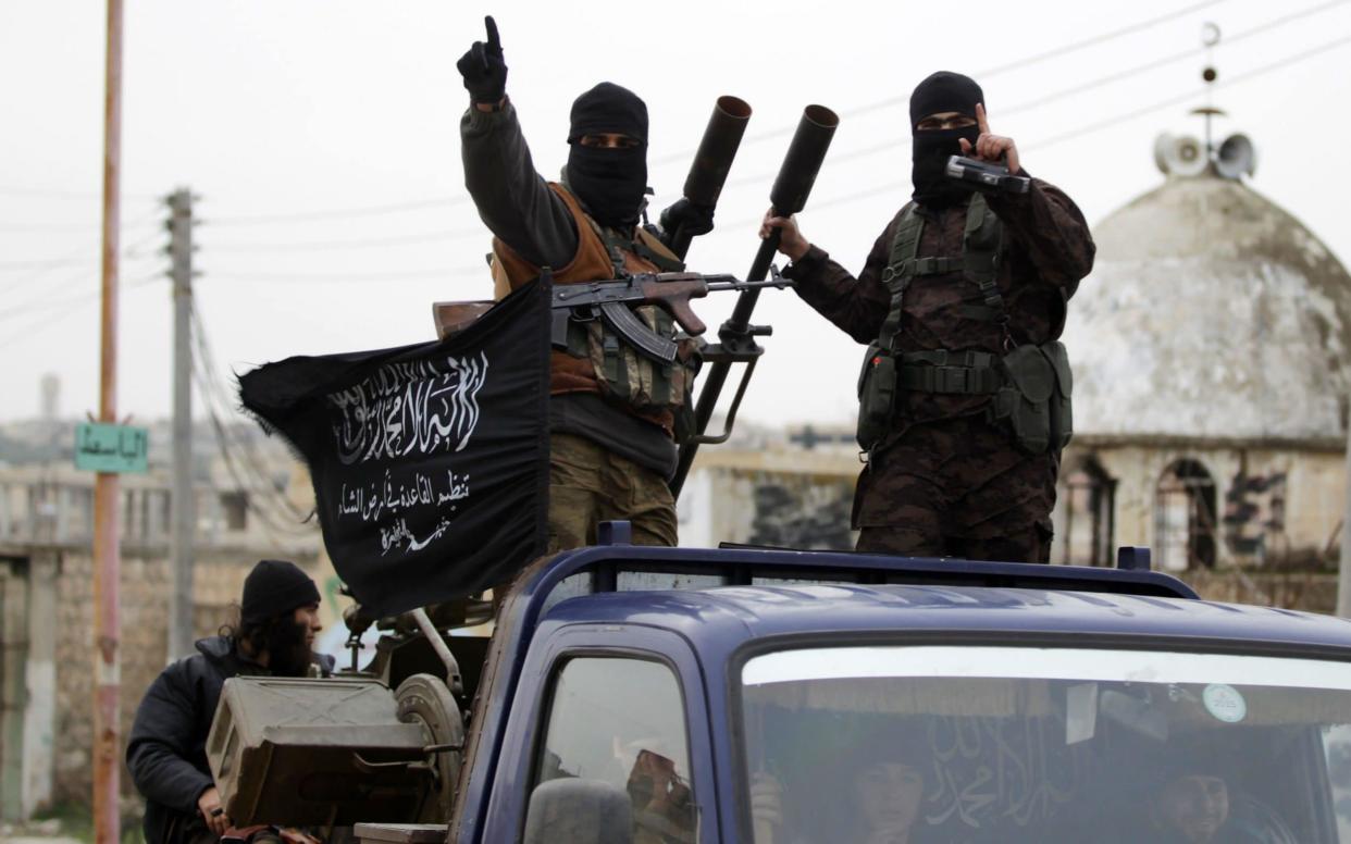 Members of Nusra Front pictured in Syria in 2014, when the group was part of al-Qaeda  - Reuters