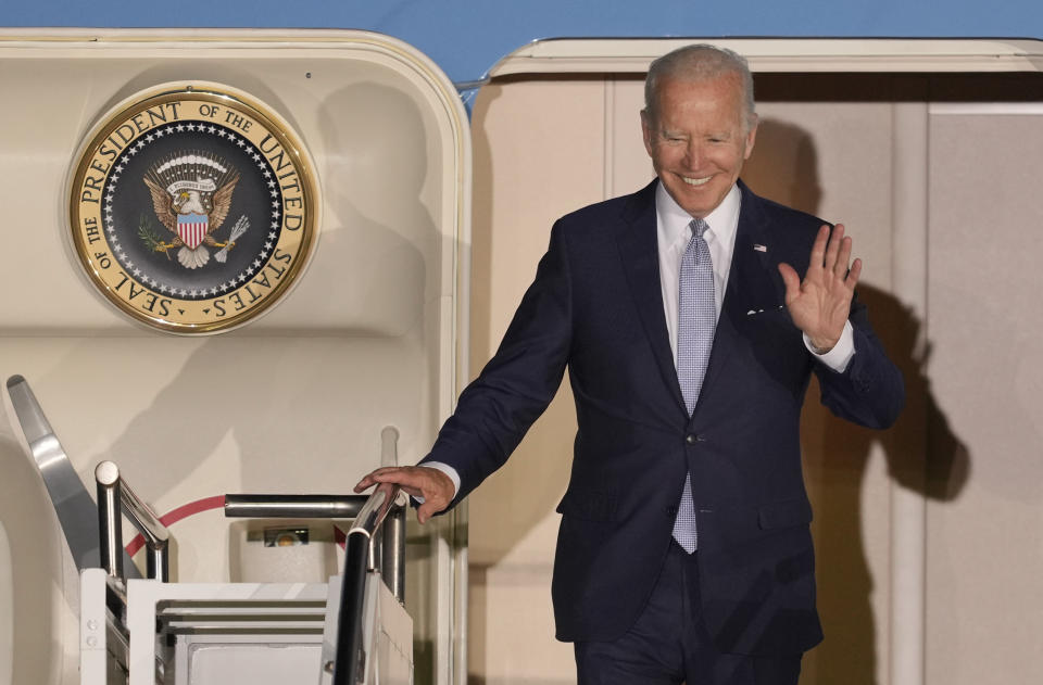 President Joe Biden waves as he leaves Air Force One after arriving at Franz-Josef-Strauss Airport near Munich, Germany Saturday, June 25, 2022, ahead of the G7 summit. The G7 Summit will take place at Castle Elmau near Garmisch-Partenkirchen from June 26 through June 28, 2022. (AP Photo/Markus Schreiber)