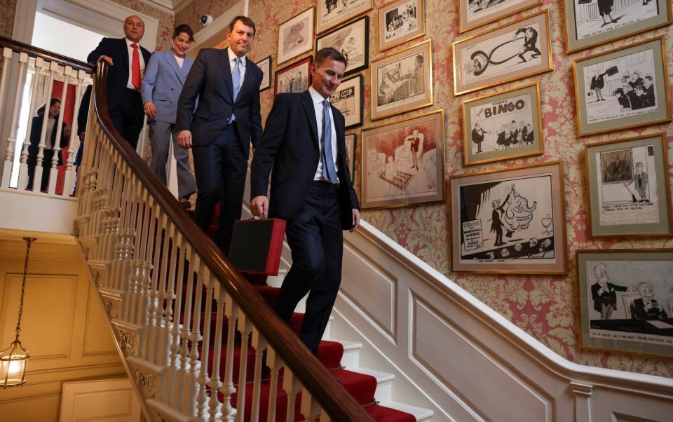 Jeremy Hunt, the Chancellor, and his team, prepare to leave 11 Downing Street to deliver his Spring Budget - Simon Dawson/10 Downing Street