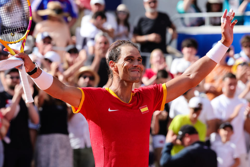 Rafael Nadal celebrates at the Olympics.