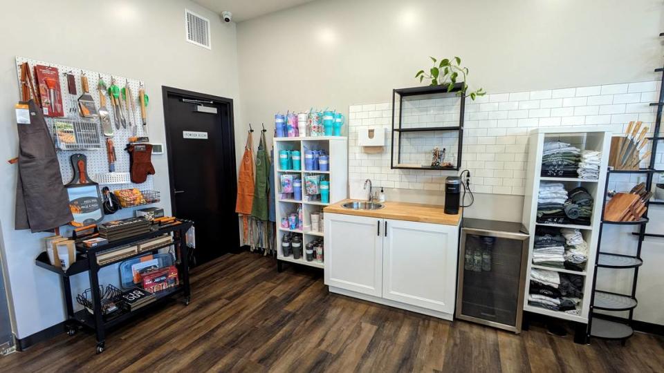 This view of Toast & Table shows the grilling tools, travel tumblers, branded items and a hand-washing station.