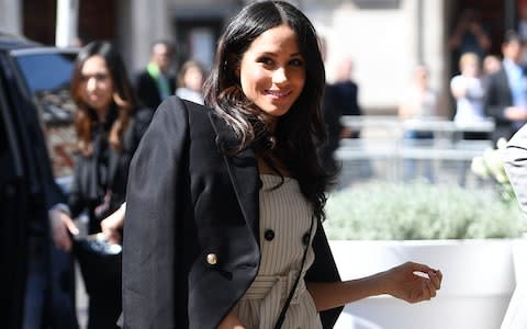 Meghan Markle, pictured on Wednesday afternoon, is said to be 'hugely excited' to be sharing Harry's Commonwealth duties - Credit: Andrew Parsons / i-Images 