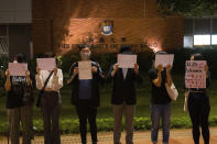 FILE - Protesters hold up white paper some with writings commemorating the Nov 24 deadly Urumqi fire during a gathering at the University of Hong Kong in Hong Kong, Tuesday, Nov. 29, 2022. The recent wave of protests against China's anti-virus restrictions was a ray of hope for some supporters of Hong Kong's own pro-democracy movement after local authorities stifled it using a national security law enacted in 2020, but not everyone agrees. (AP Photo/Bertha Wang, File)