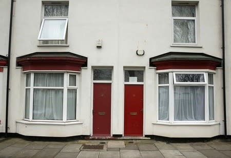 Painted red front doors are seen on a terraced street in the Gresham area of Middlesbrough, northern Britain, January 20, 2016. REUTERS/Phil Noble