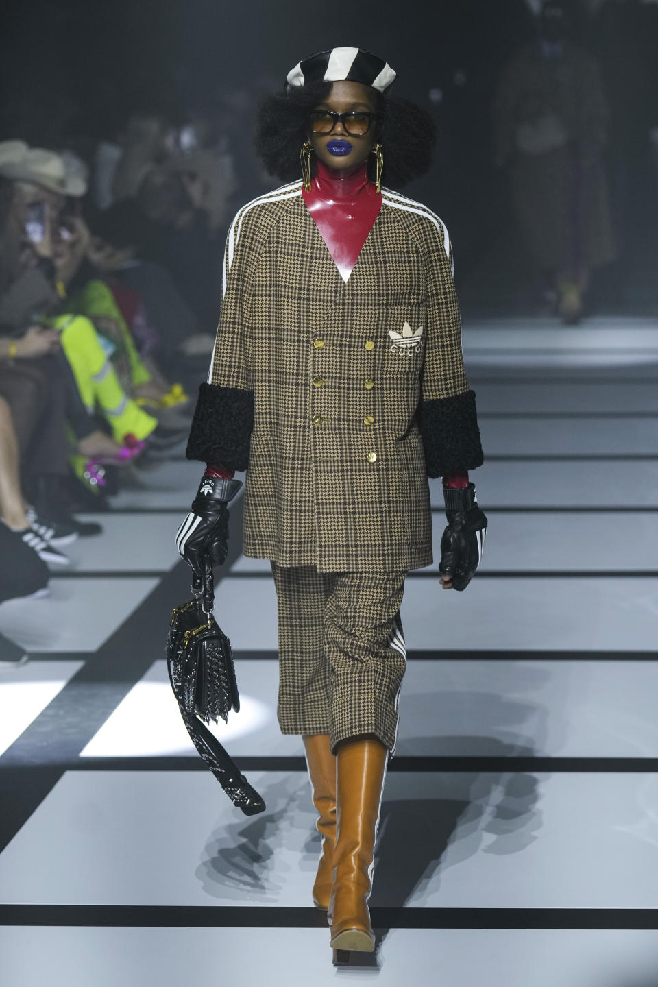 FILE A model wears a creation as part of the Gucci Fall/Winter 2022-2023 fashion collection, unveiled during the Fashion Week in Milan, Italy, Friday, Feb. 25, 2022. Alessandro Michele is leaving his role as creative director of the Gucci, the fashion house announced Wednesday, Nov. 23, 2022 bringing an end to an eight-year tenure that sharply redefined Gucci’s codes with romanticism and gender-fluidity, all the while powering revenues for the Kering parent. (AP Photo/Antonio Calanni, File)