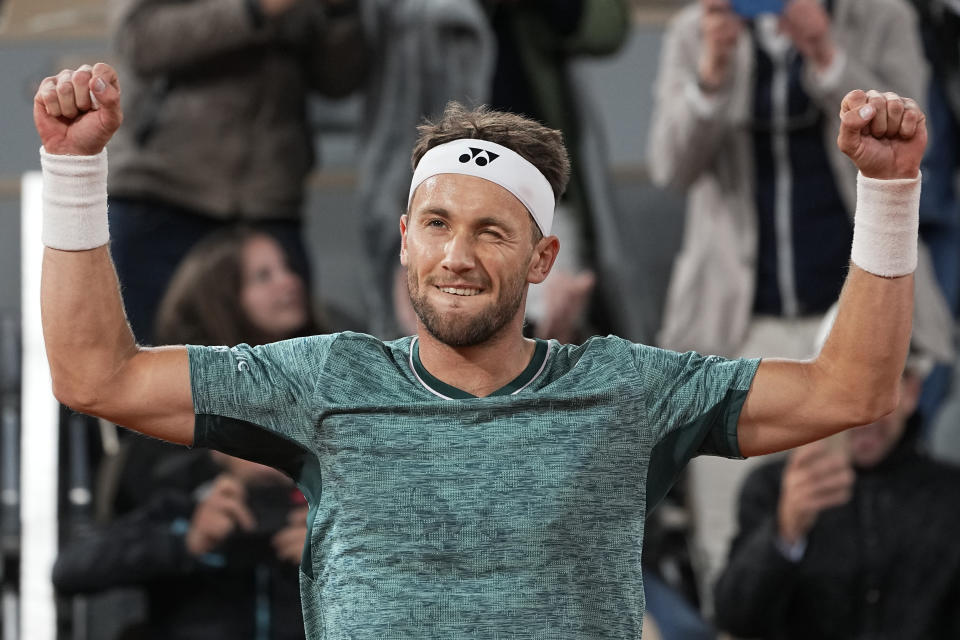 Norway's Casper Ruud celebrates winning his quarterfinal match against Denmark's Holger Rune in four sets, 6-1, 4-6, 7-6 (7-2), 6-3, at the French Open tennis tournament in Roland Garros stadium in Paris, France, Thursday, June 2, 2022. (AP Photo/Michel Euler)