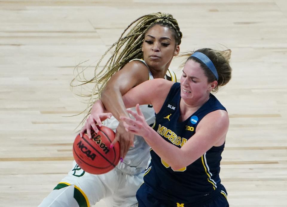Baylor Lady Bears guard DiJonai Carrington (21) battles for the ball with Michigan Wolverines forward Emily Kiser (33) in the Sweet 16.