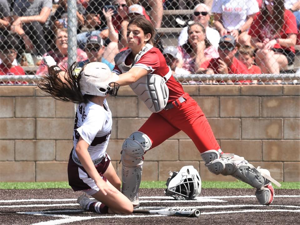 Hermleigh catcher Sydney Hancock, right, tags out Eula's Laney Fostel.